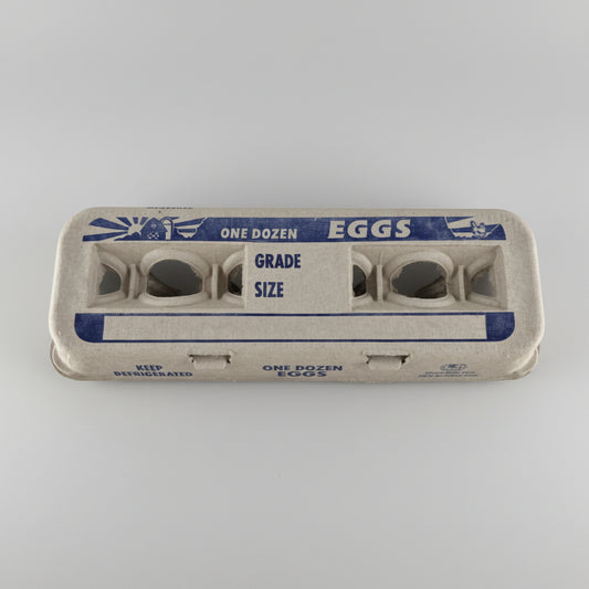 Egg carton with sunrise design on a white background